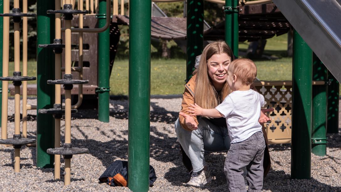 Mom and son playing at the park 