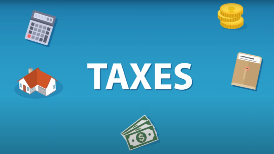Taxes on screen text with blue background