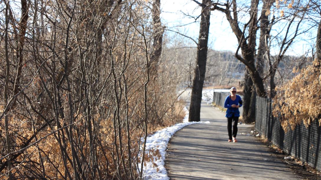 women running down an outdoor pathway