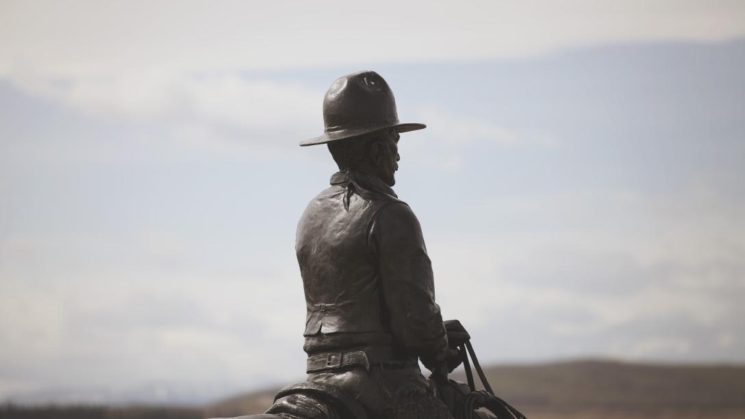 Image of the Men of Vision statue facing south