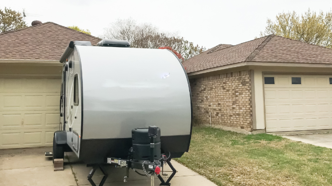 Picture of a trailer on a house driveway 