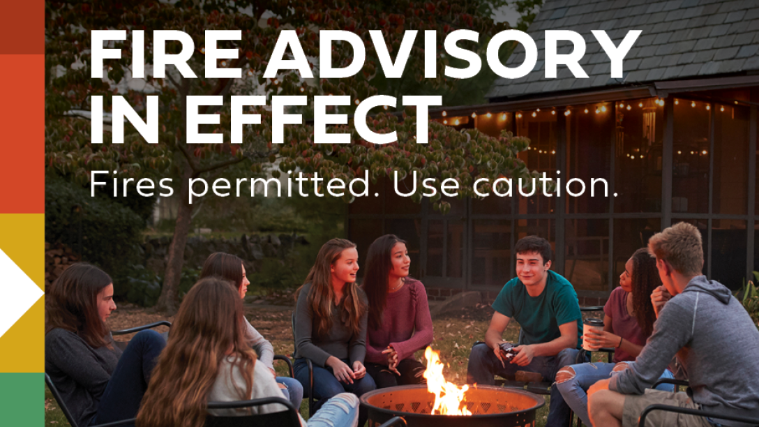 fire advisory in effect for the town of Cochrane - people sitting around an open fire