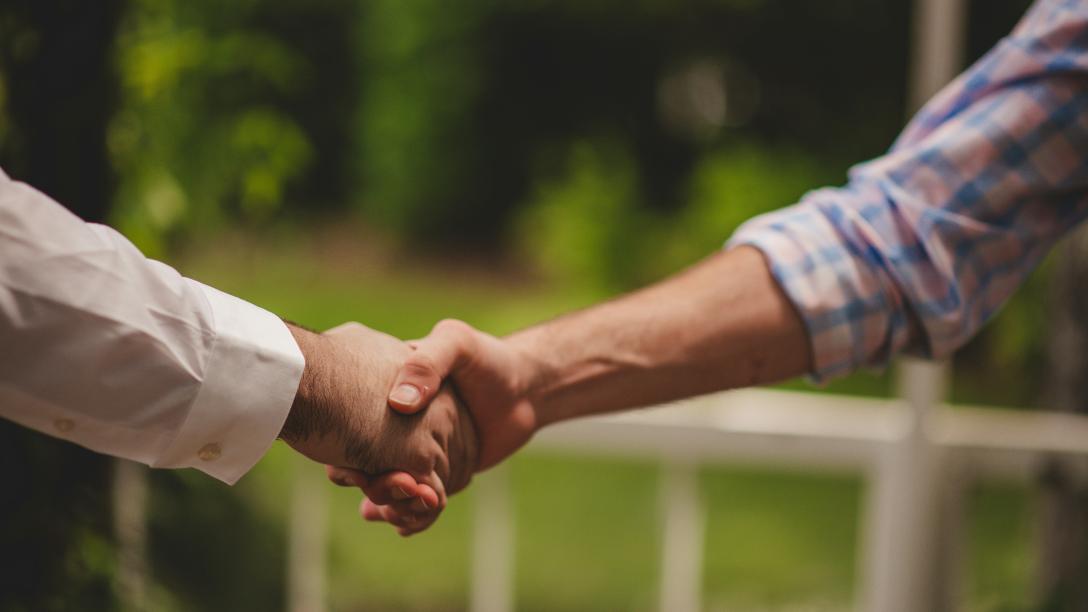 two people shaking hands