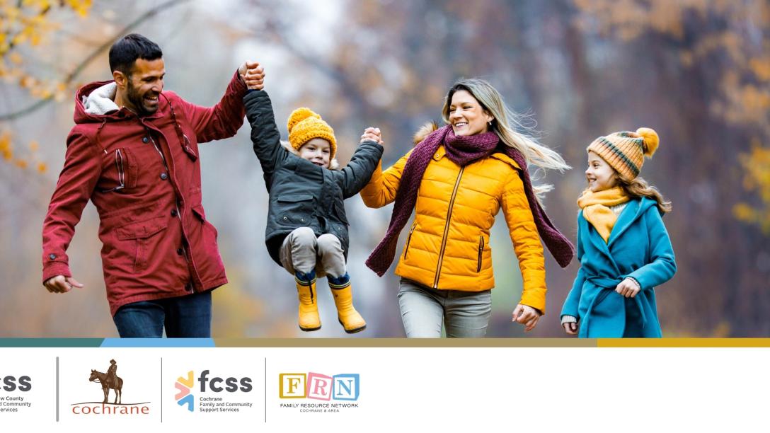 A family playing in the Fall weather