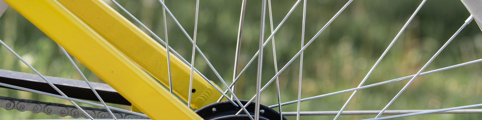 close up of yellow bike bike wheel 