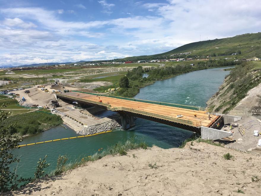 Bare bridge girders placed on construction site.