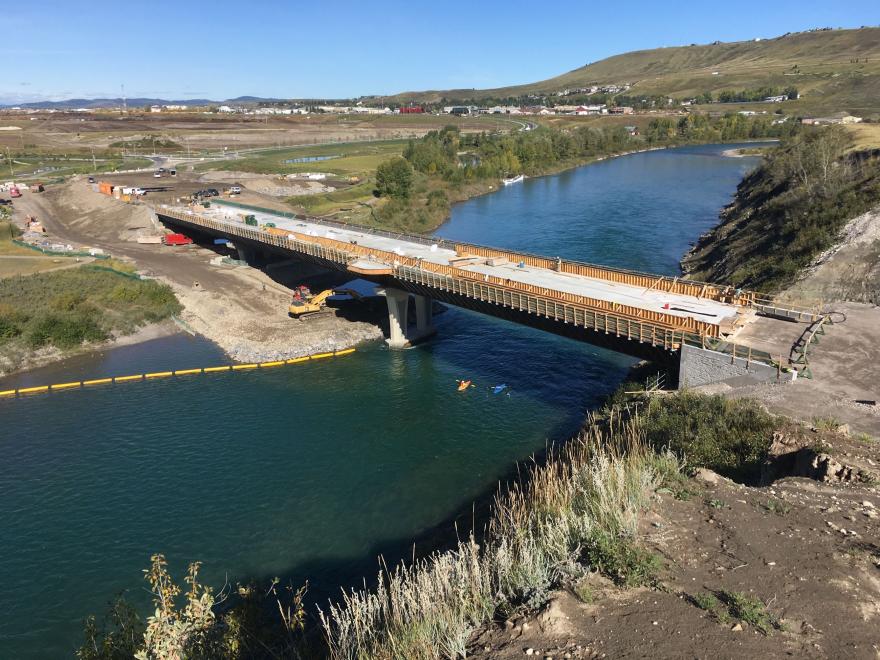 Side view of bridge under construction. Most of the bridge is constructed.