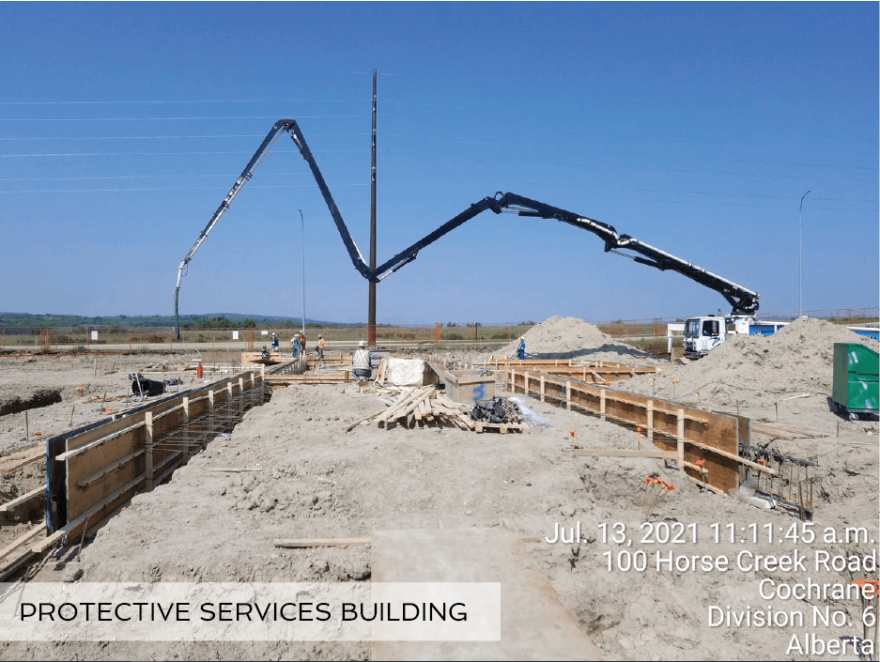 Construction equipment preparing foundation area for new Protective Services Building.