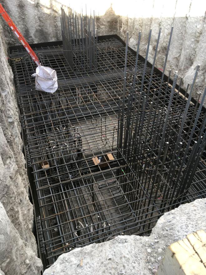 Rebar lattice-like structure inside of hole.