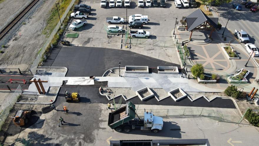 Aerial view of The Station's parking lot. There are cars parked in the lot.