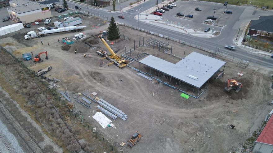 Aerial view of construction area for The Station. Roofing is being installed on the steel structure that serves as the base of the building.