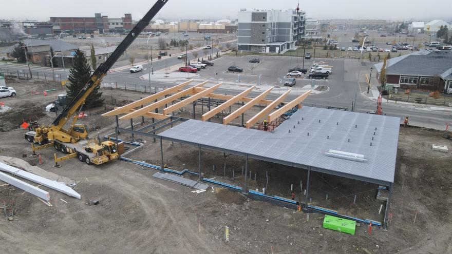 Aerial view of construction area for The Station. Roofing is being installed on the steel structure that serves as the base of the building.