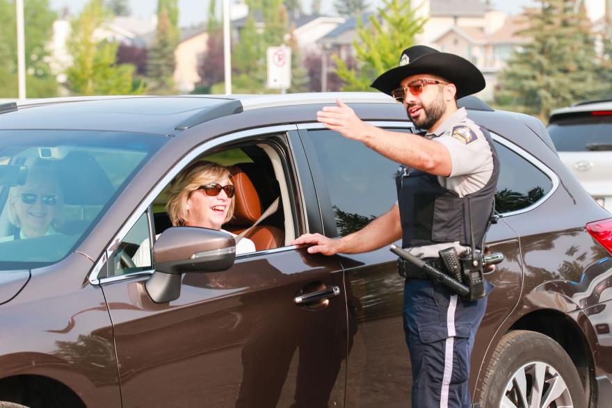 Officer talking to driver in vehicle