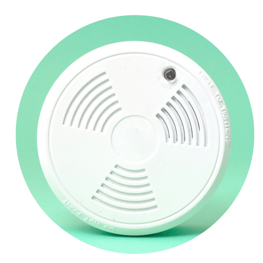 image of a smoke detector with a green background in it