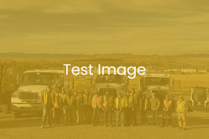 test image - employees standing in front of work vehicles