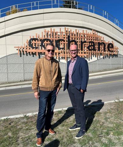 Mayor and Peter Guthrie in front of Cochrane AB wall enhancement