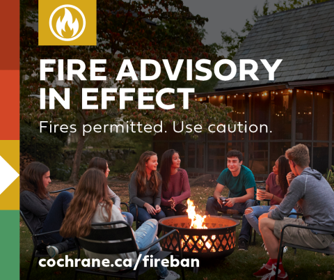 fire advisory in effect for the town of Cochrane - people sitting around an open fire