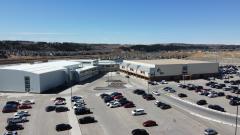 aerial view of SLS building and parking lot 